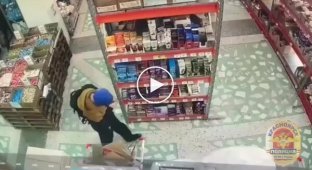 A man with a knife attacked a store security guard while trying to take out alcohol and food