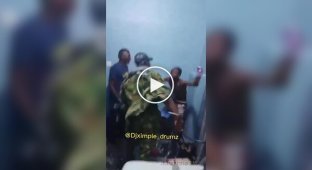 Nigerian army soldiers beat a civilian