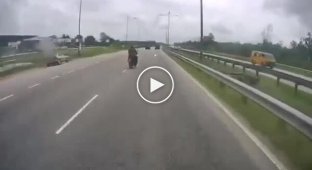 Dangerous lane change on a motorcycle into a bus