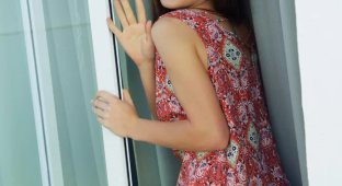 Petite Angely Grace in a chair