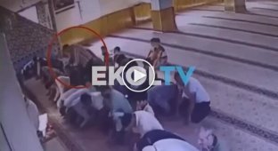 A killer lay in wait for his victim in a Turkish mosque and attacked him from behind during prayer