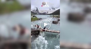 In Tibet, a horse fell off a bridge and became entangled in a railing.