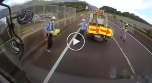 Accident in Japan involving a car transporter and road equipment