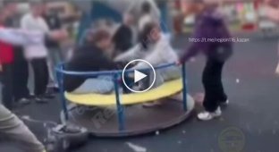 Schoolgirls spin a carousel with an electric scooter and get injured