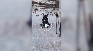 In Kosovo, two guys on a sled at full speed hit a girl