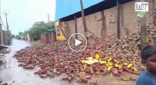 A section of a wall collapsed on an Indian man