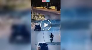 In Argentina A driver saved a scooter rider from robbery by hitting the robber.