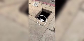 In Hollywood, a homeless man settled in a hole in the sidewalk.