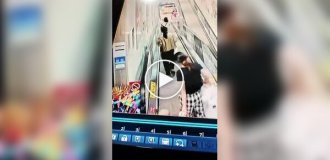 A ride-on car hit a woman and a child on a moving walkway