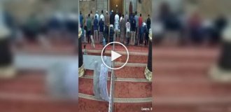 Girls knocked over a fence at a mosque and then pretended to pray