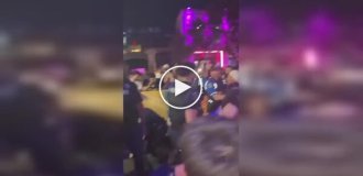 A police officer hit a guy during a street brawl