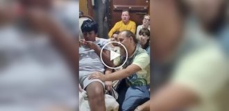 In Bali, a crowd of Russians worship a guy on the sofa for money