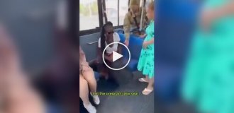 A black woman took a seat on a bus for her bag