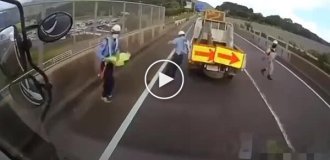 Accident in Japan involving a car transporter and road equipment