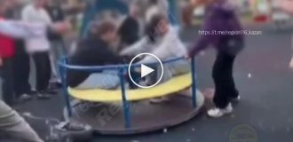 Schoolgirls spin a carousel with an electric scooter and get injured