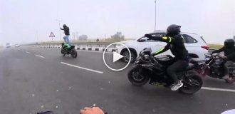 A motorcycle struggled to shake off an idiot rider, and eventually succeeded