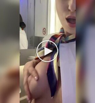 A flight attendant shows her breasts in her free time from work