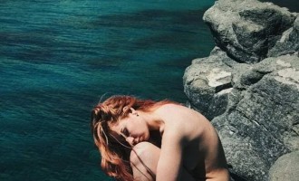 Beautiful lovers of relaxing in nature without clothes