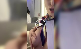 A flight attendant shows her breasts in her free time from work