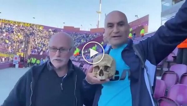 Soccer fan came to the match with a skull