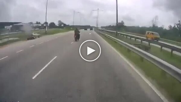 Dangerous lane change on a motorcycle into a bus