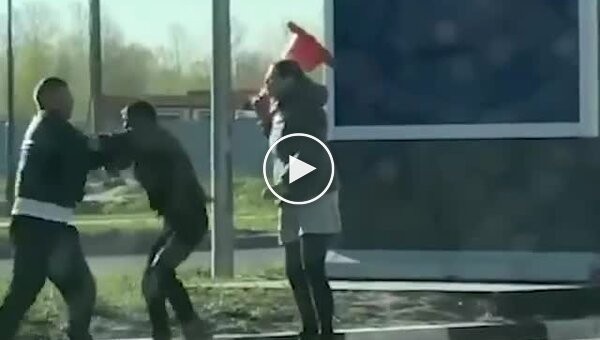 A Russian woman beat a driver who attacked her companion at a gas station with a traffic cone