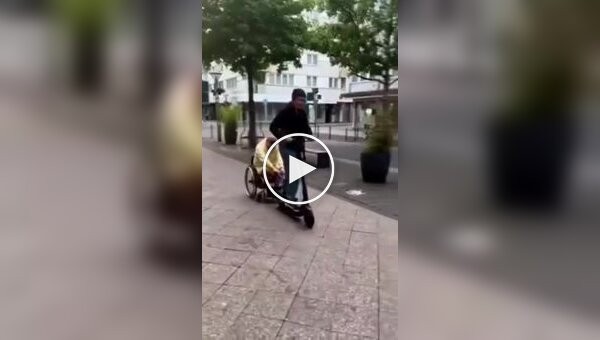 A scooter rider and his wheelchair-bound friend