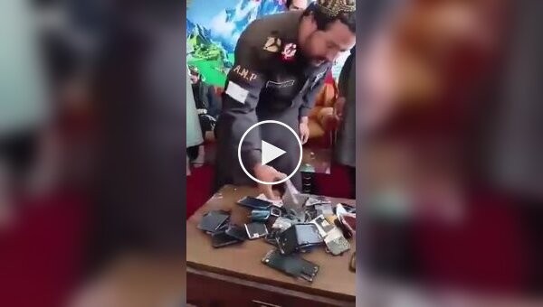 Taliban members smashed their smartphones as a sign of loyalty to the Supreme Leader