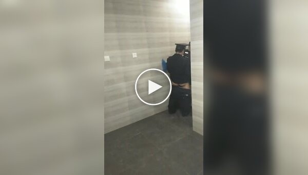 Chinese police in the restroom