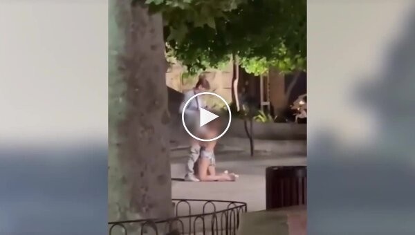 Tourists engaged in indecency in front of a church in Europe
