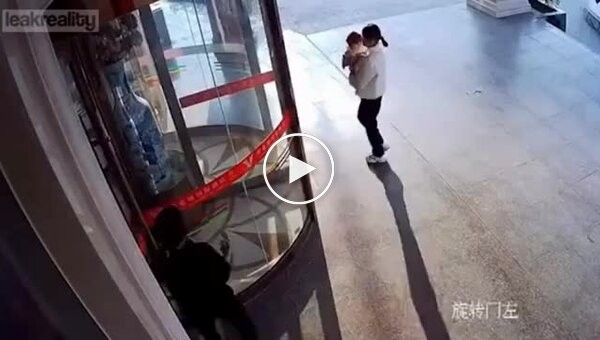 Mother and child unsuccessfully entered a revolving door