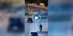 In Argentina A driver saved a scooter rider from robbery by hitting the robber.